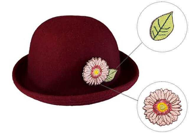 刺繡ブローチを付けた帽子