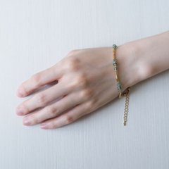 ボタンカットのガラスビーズにゴールドの竹ビーズを組み合わせたブレスレット画像